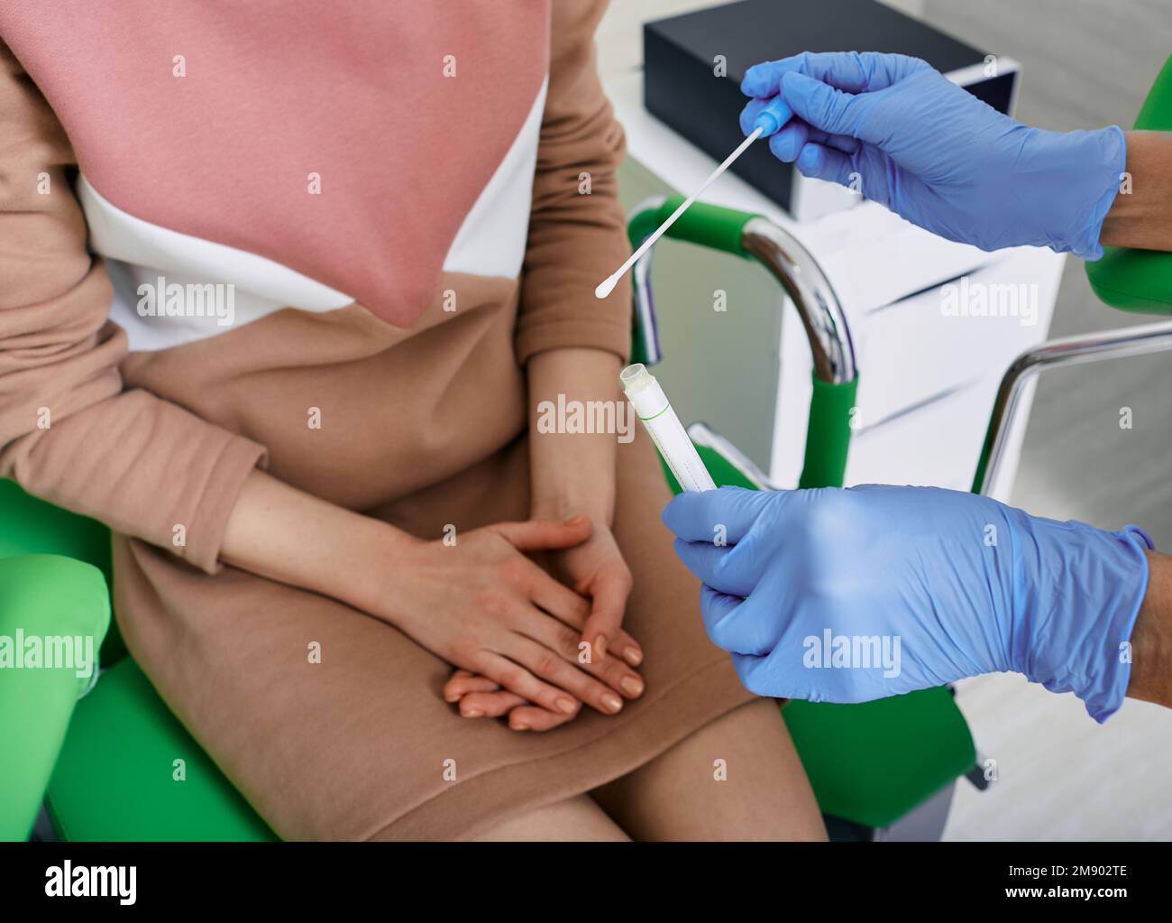 Analysis of urogenital smear for microflora. Gynecologist doctor taking smear for flora from female patient in gynecological office, close-up Stock Photo
