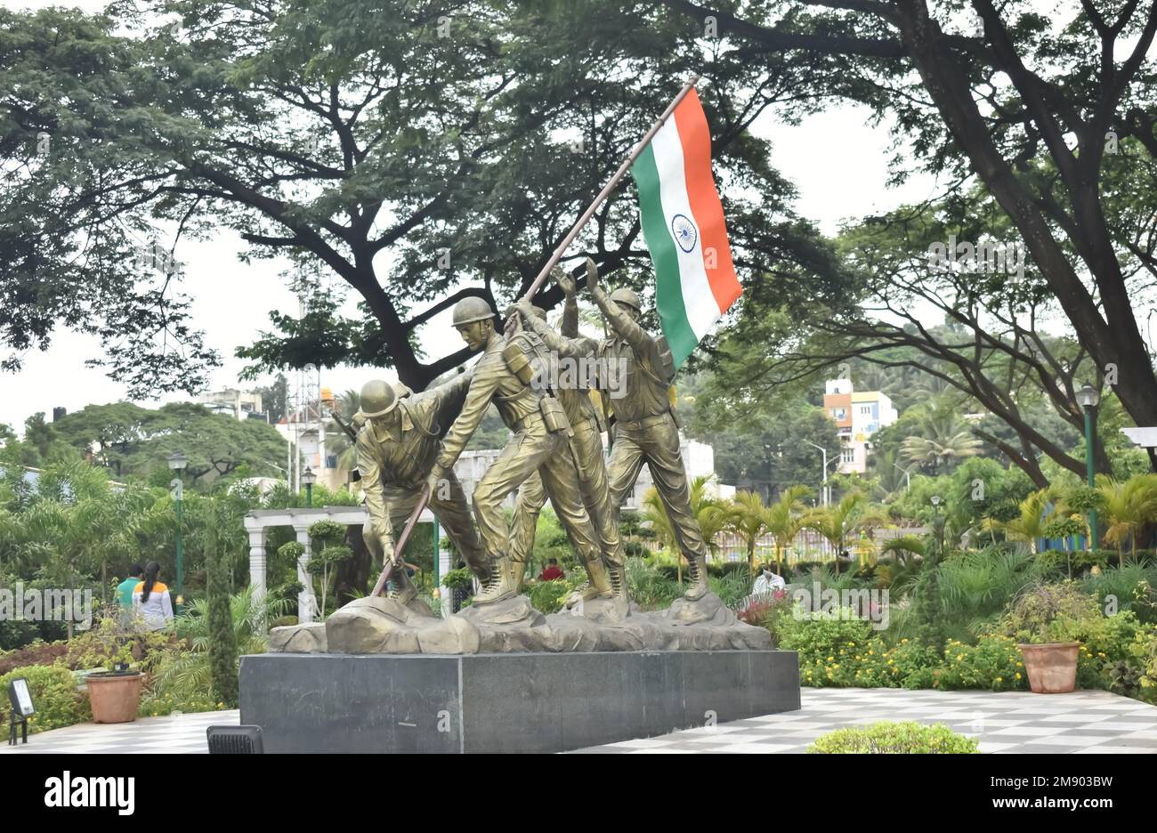 A Picture of Indian Soldiers Planting the National Flag. In Memory of Kargil Divas or Armed forces flag day installed in a park in Bangalore, India Stock Photo