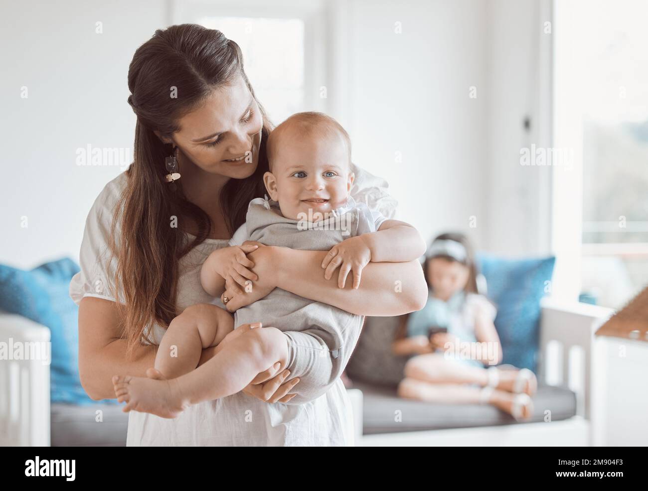 My perfect little boy. a beautiful young mother bonding with her newborn at home. Stock Photo