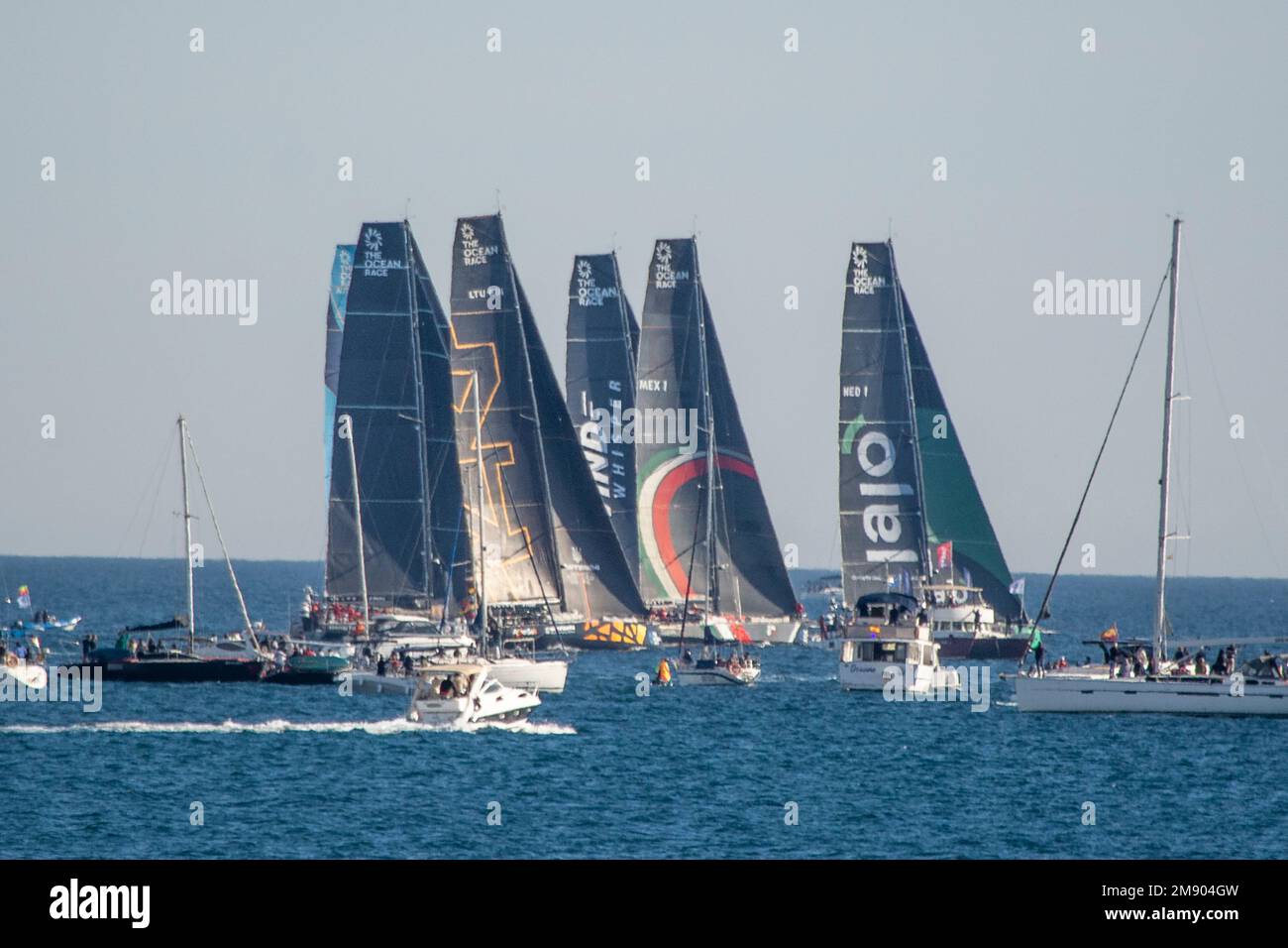 VO65 Class Yachts prepare to start there race around Alicante bay Stock Photo