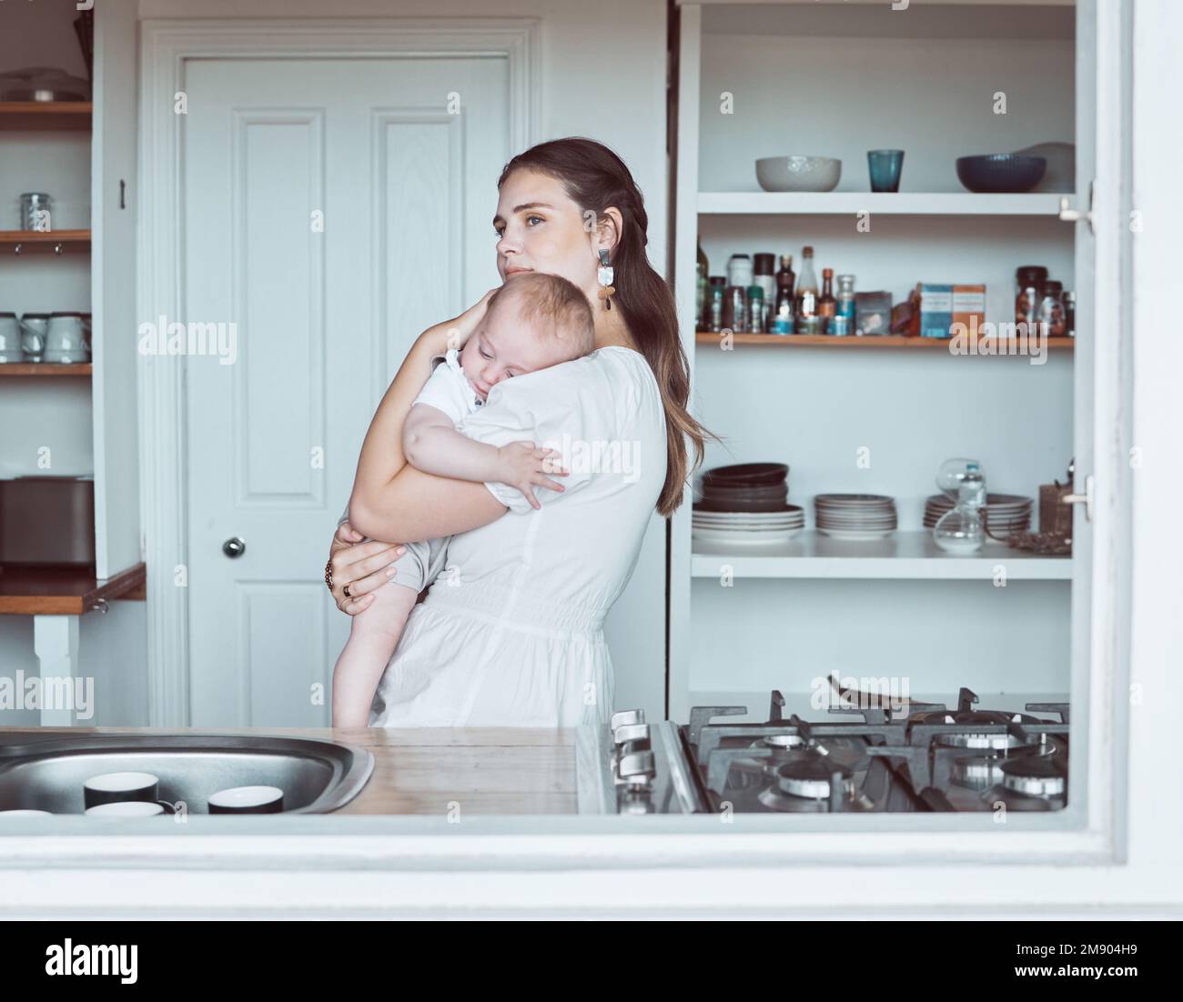 His existence saved me. a beautiful young mother bonding with her newborn at home. Stock Photo