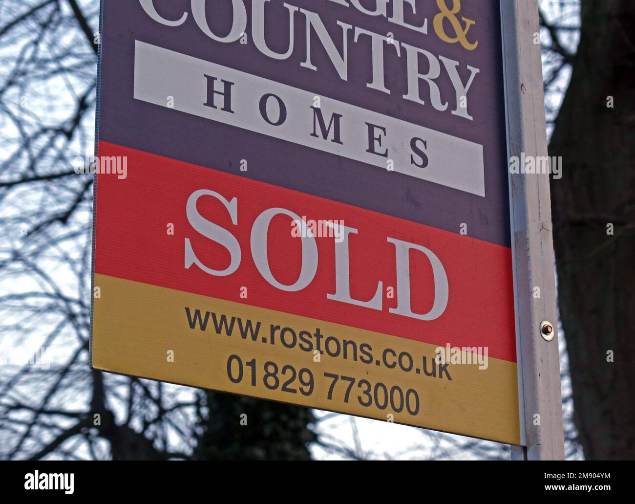 Sold sign, Country home sold in the overheated rural property market Stock Photo