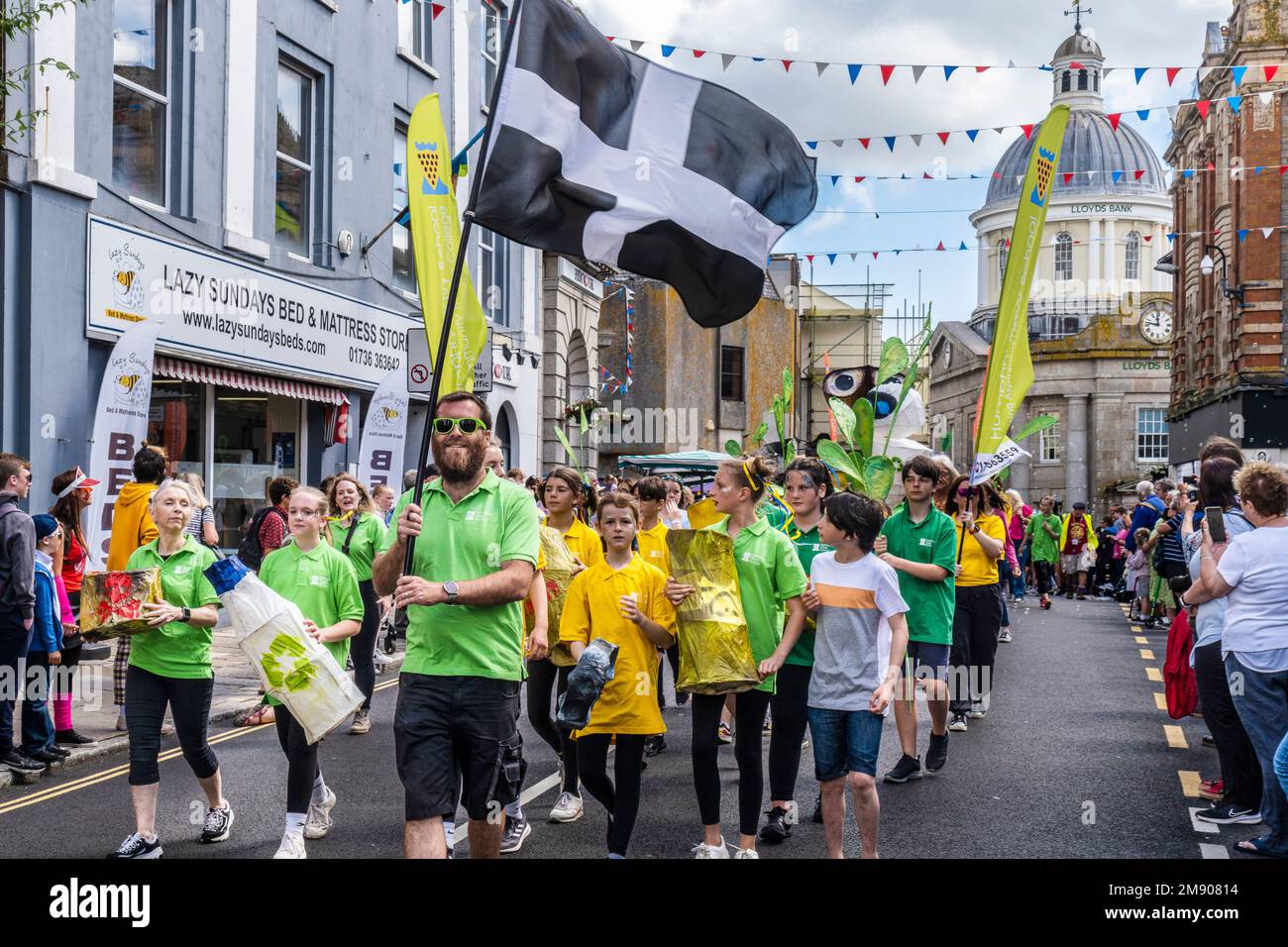 Staff Teachers and students pupils from Humphry Davy participating in a procession on Mazey Day during the Golowan Festival in Cornwall in England in Stock Photo