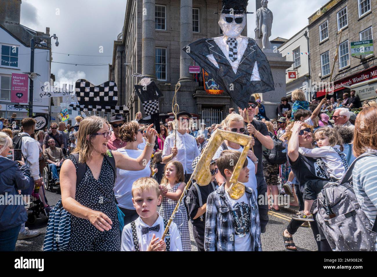Large withy and paper Rude Boy Two Tone figures carried during the Mazey Day celebrations as part of the Golowan Festival in Penzance in Cornwall in t Stock Photo