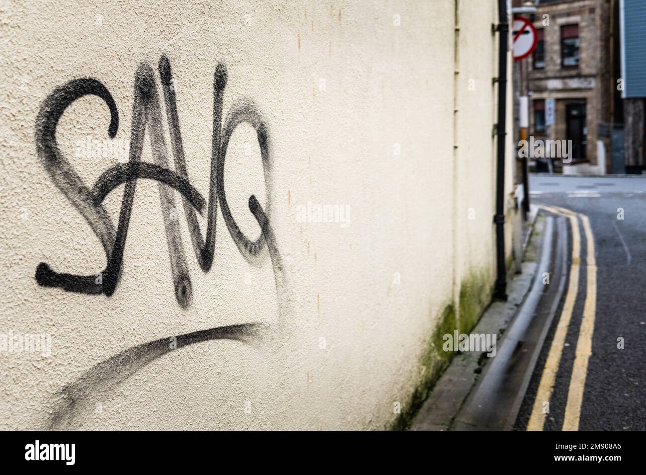 Graffiti Tag sprayed on a wall in Newquay Town centre in Cornwall in England in the UK. Stock Photo