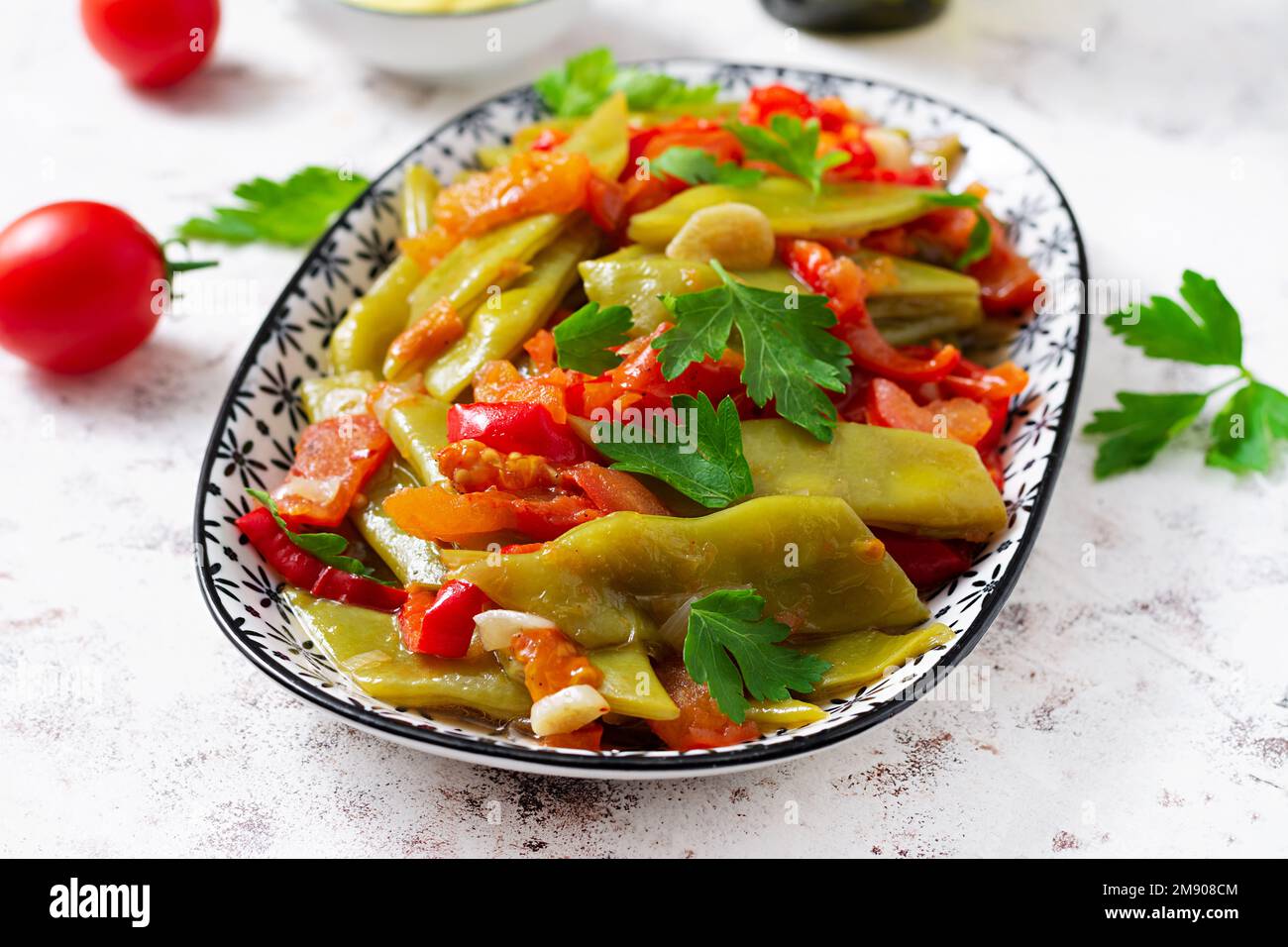 Homemade stewed green beans, tomatoes, garlic with olive oil