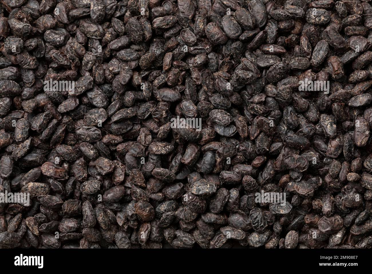 Chinese salted black beans as an ingredient close up full frame as background Stock Photo