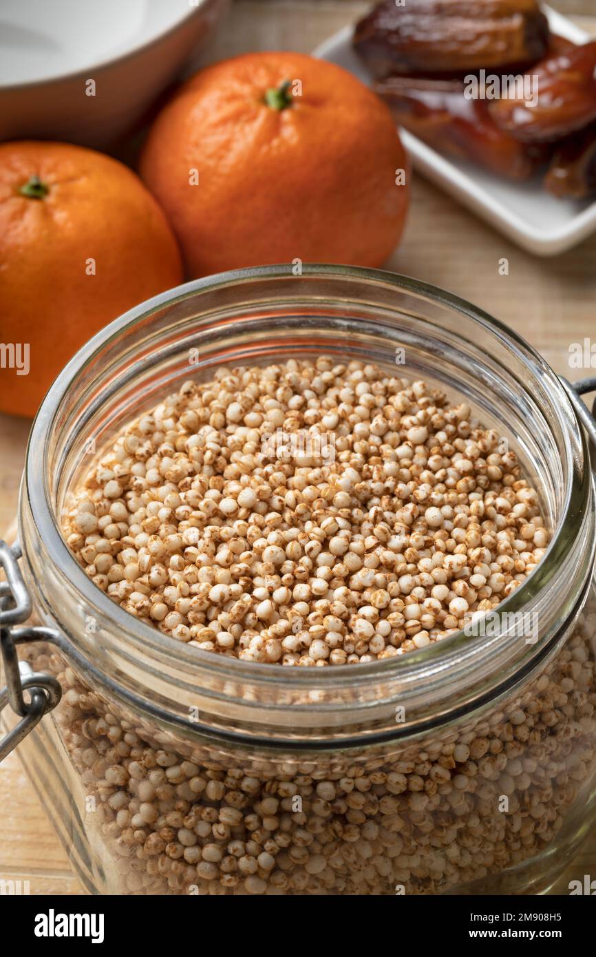Glass bowl with healthy puffed quinoa close up as an ingredient for breakfast Stock Photo