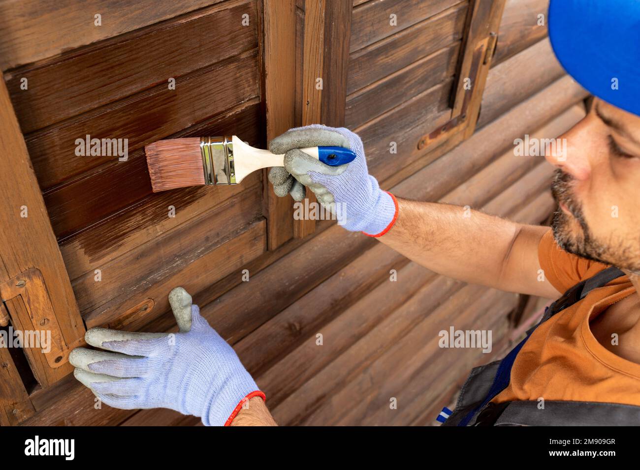 Painting or staining woodwork outside Stock Photo Alamy