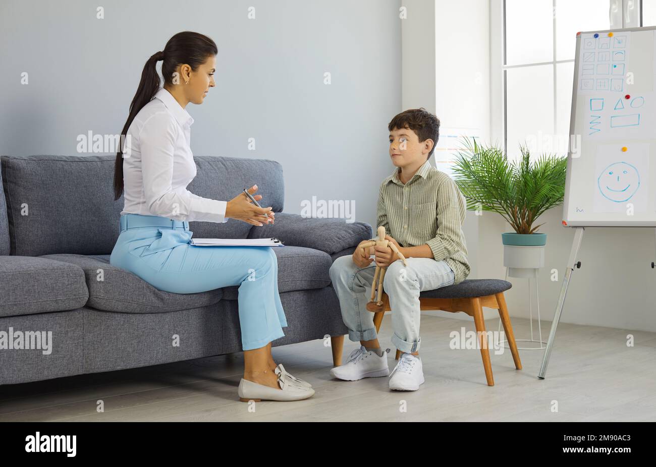 Therapist, psychologist or school counselor having a conversation with