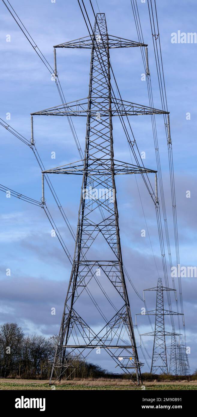 Lincolnshire, England UK - Electricity pylons running across farmland in Lincolnshire Stock Photo