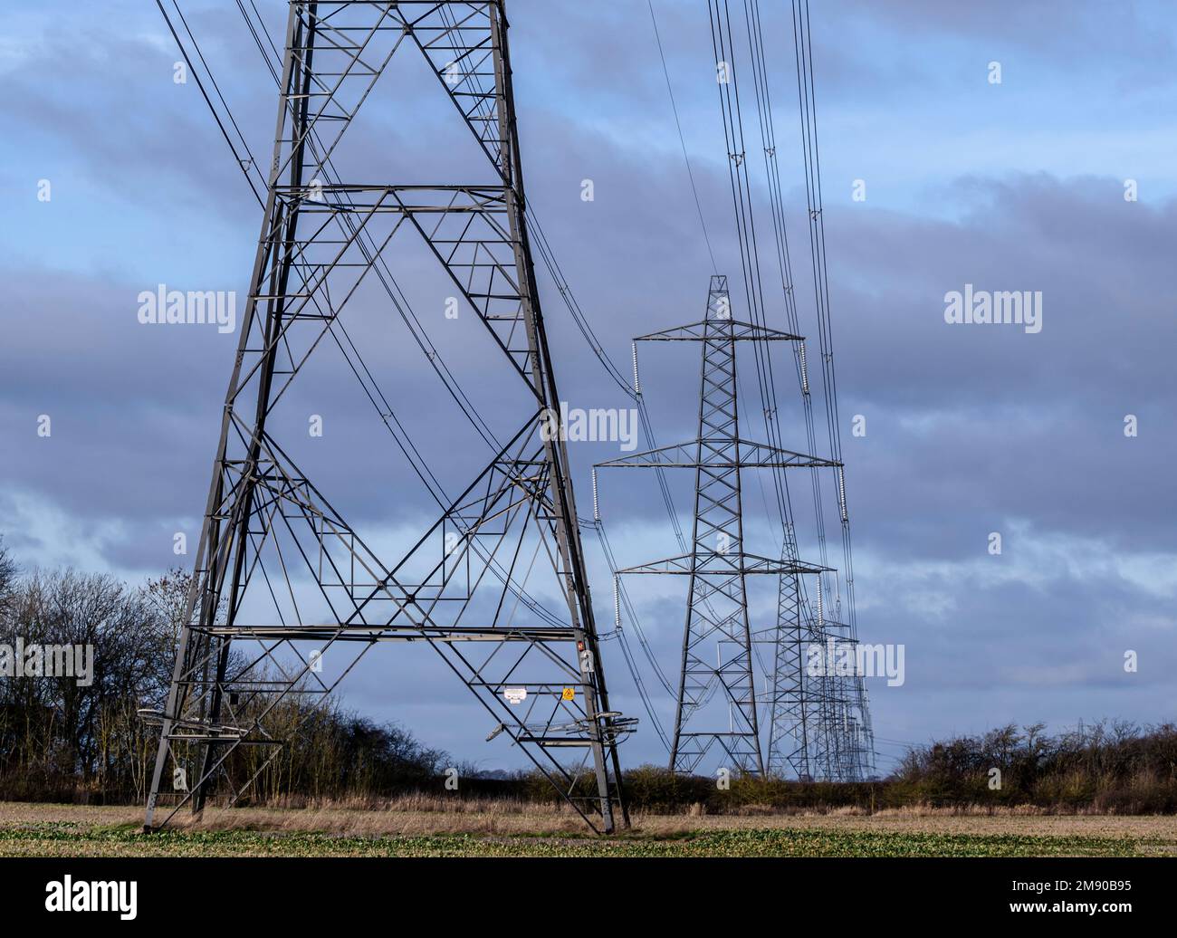 Lincolnshire, England UK - Electricity pylons running across farmland in Lincolnshire Stock Photo