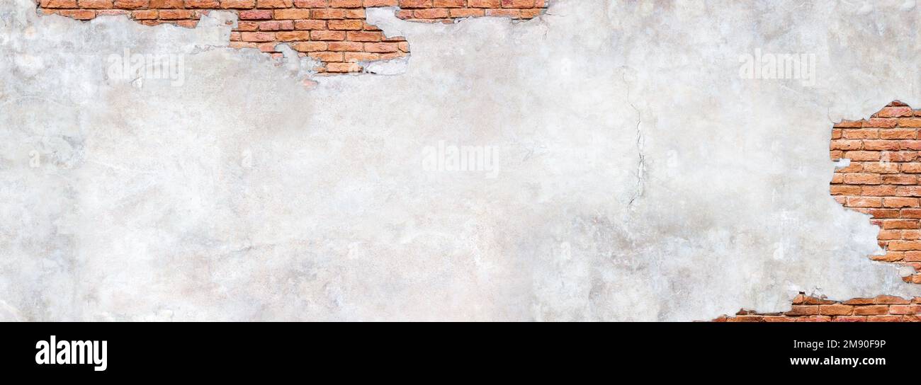 Damaged plaster on brick wall background. Brickwork under crumbling texture  concrete surface Stock Photo