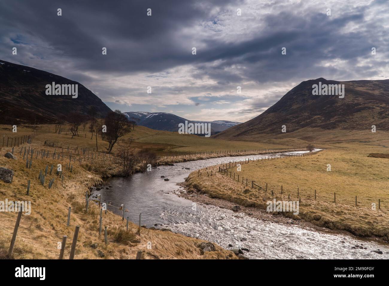 Clunie Water meandering it's way through the Cairngorms National Park, Scotland UK. March 2022 Stock Photo