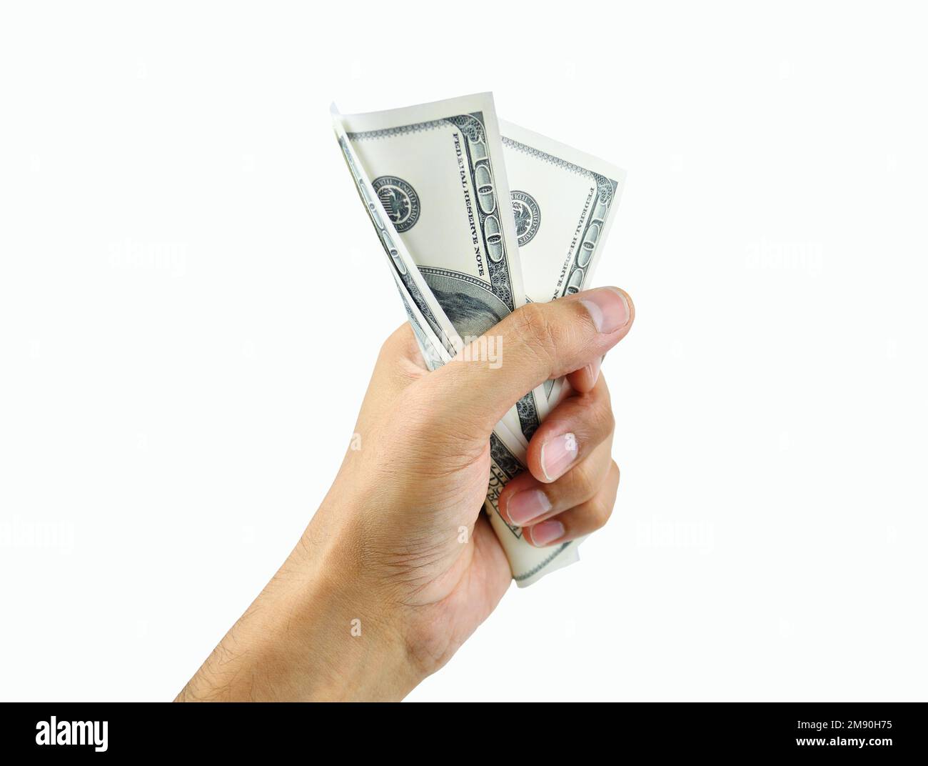 Close up of a man's hand crushing a wad of hundred dollar notes while isolated on a white background Stock Photo