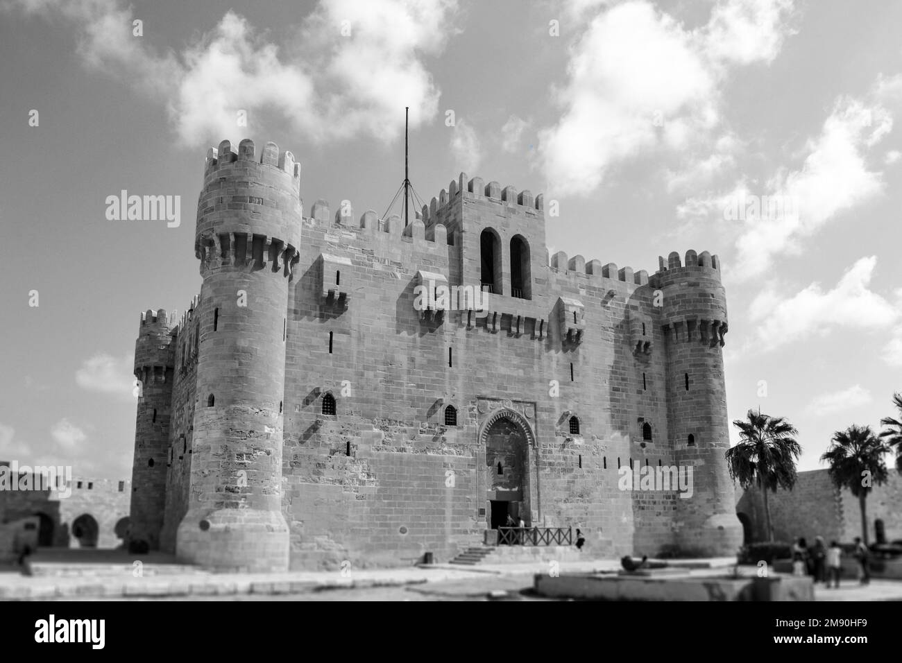 A grayscale shot of the Museu Qaitbey under a cloudy sky in Alexandria, Egypt Stock Photo Alamy