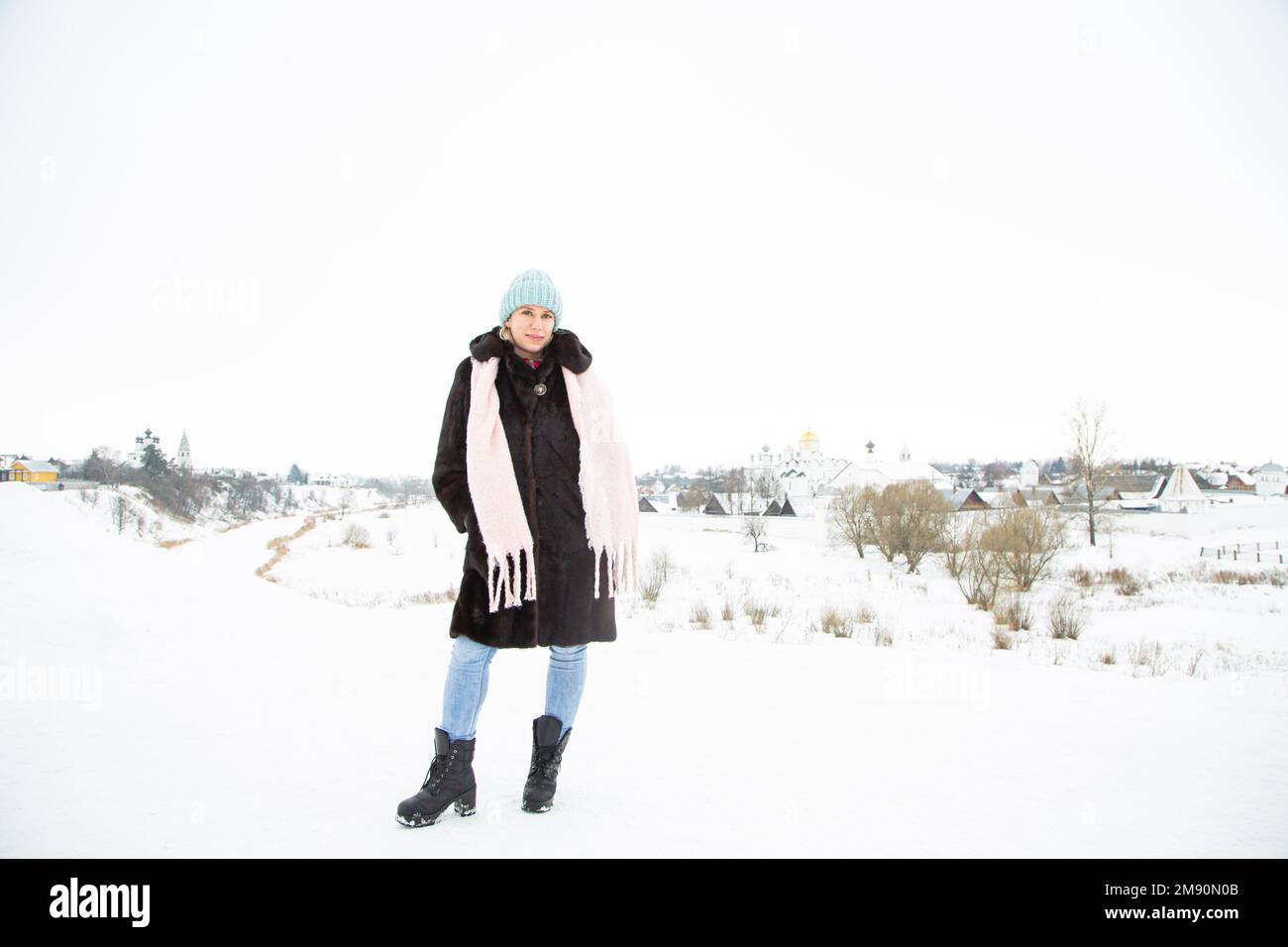 Woman walking snow vintage hi-res stock photography and images - Alamy