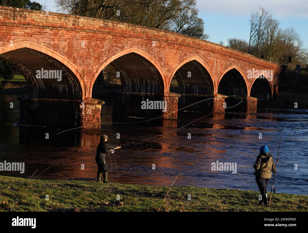 An angler casts after an opening ceremony on the opening day of the