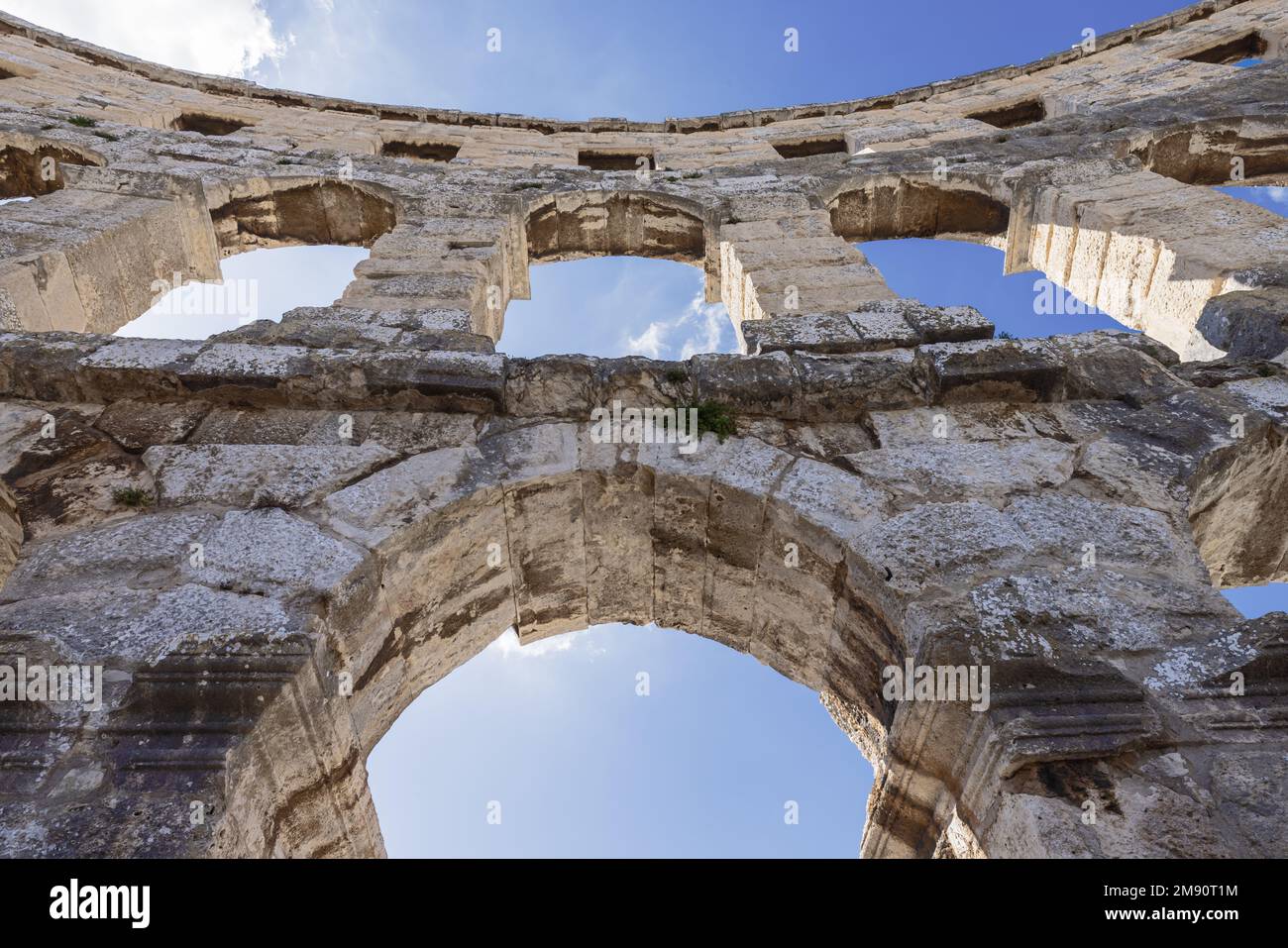 Under the arches of the amphitheater in Pula seen from the backstage in the amphitheater Stock Photo