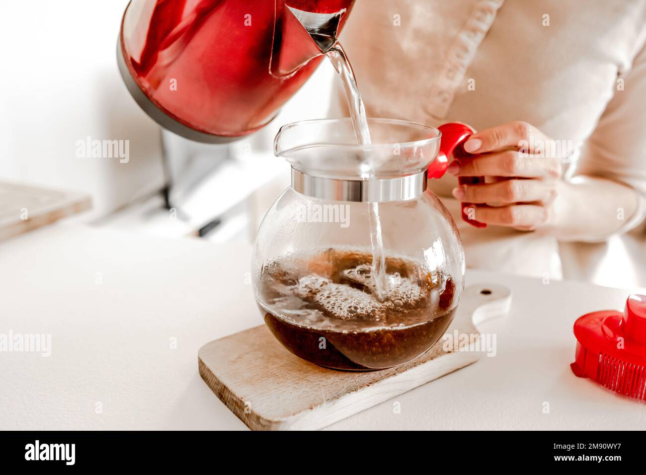 Tea preparation with teapot and cups at kitchen Stock Photo Alamy