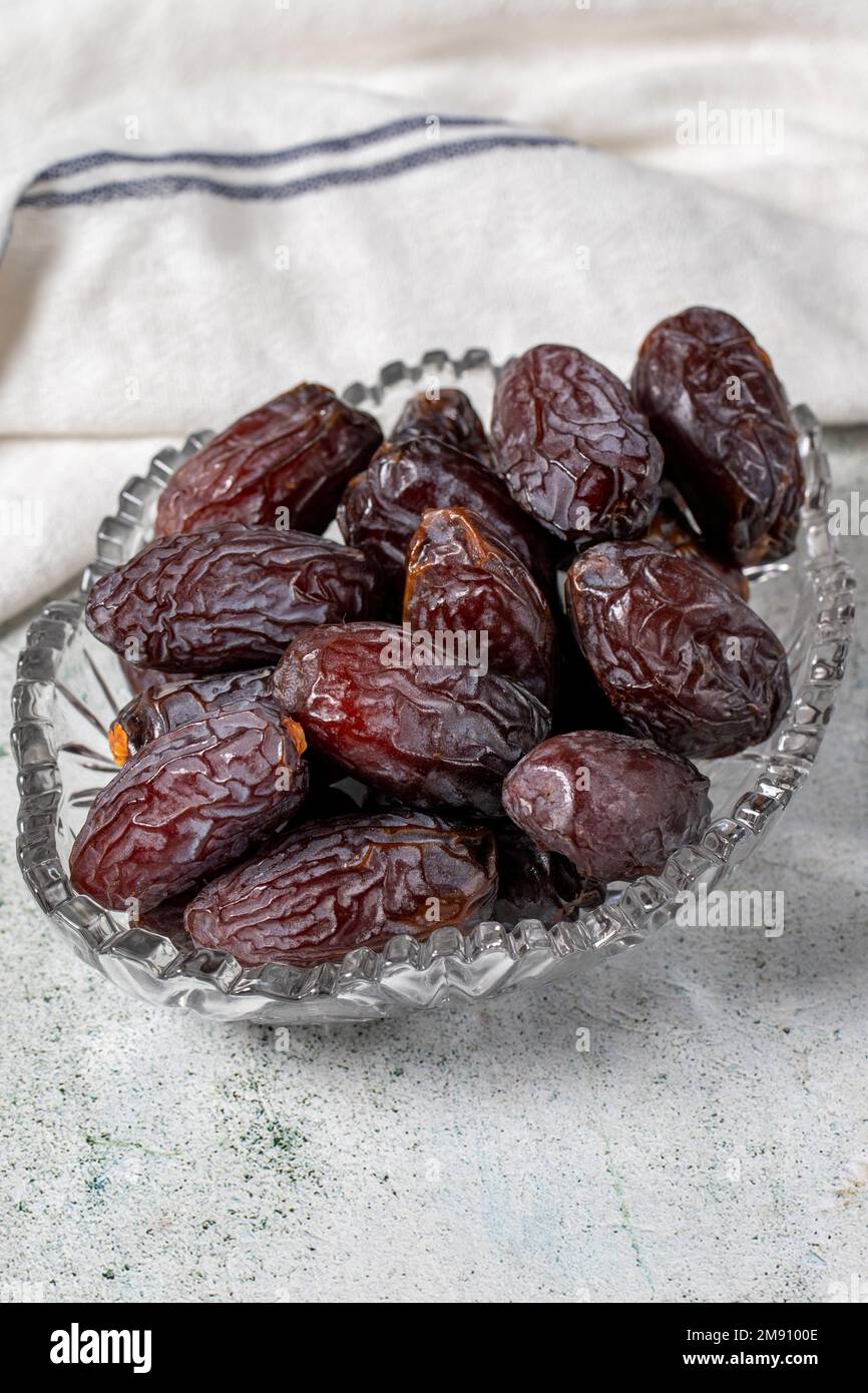 Jerusalem date fruit on stone background. Dried Big date fruit in a