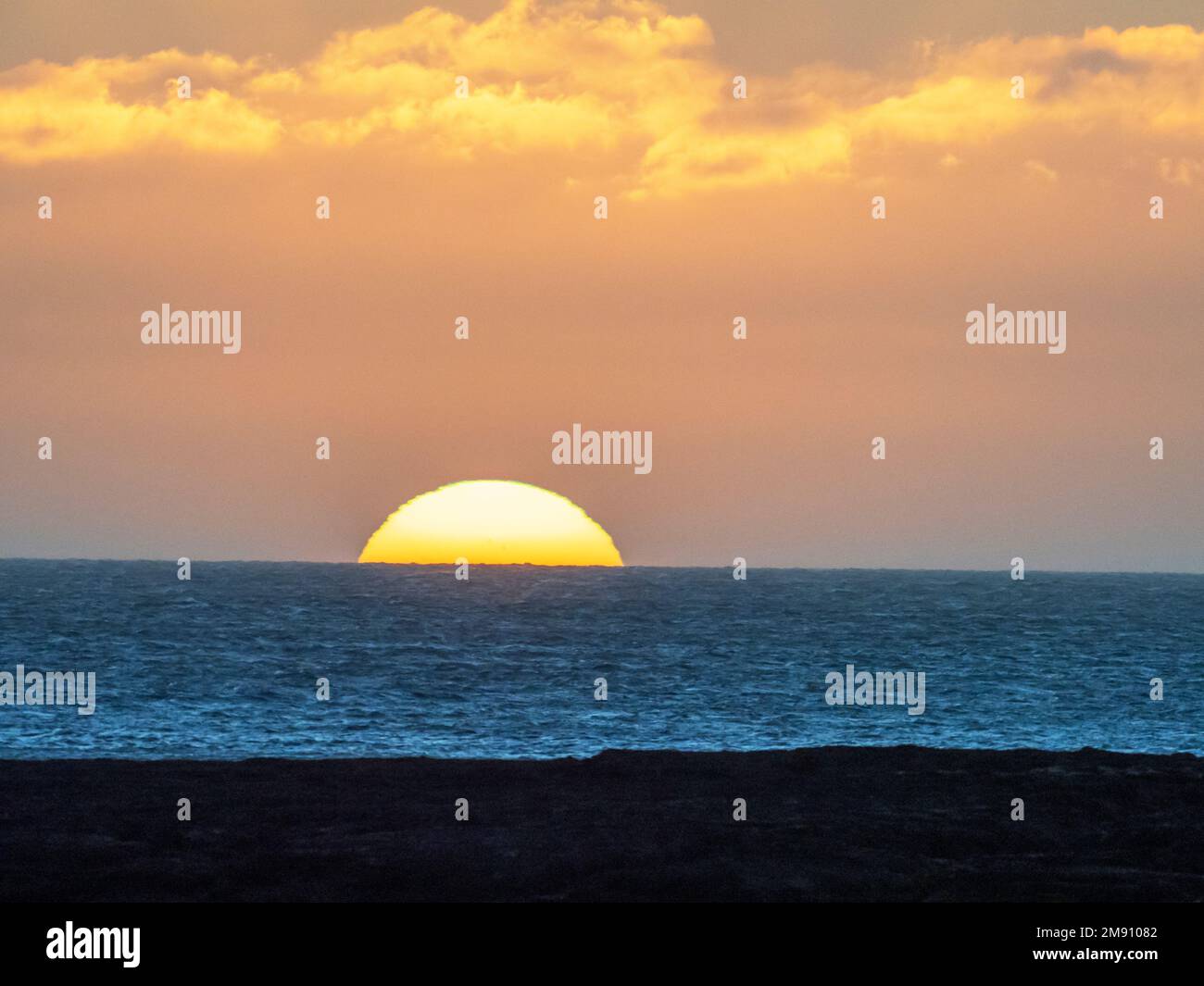 The sun rising over the North Sea from Seahouses at dawn ...