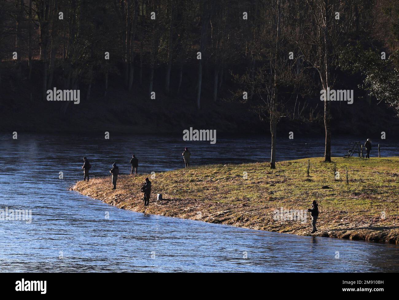 Anglers cast their lines on the opening day of the salmon fishing season on the river Tay at Meikleour fisheries, Scotland, Britain, January 16, 2023. REUTERS/Russell Cheyne Stock Photo
