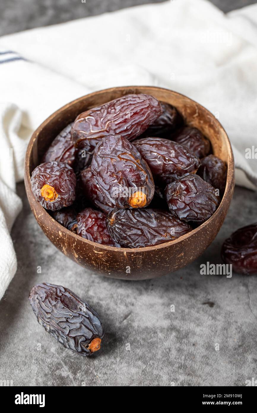Jerusalem date fruit on stone background. Huge date fruit in a coconut