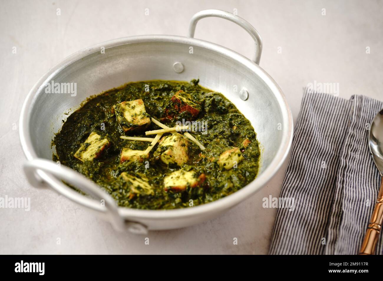 Palak paneer Indian spinach cottage cheese curry served in a kadai