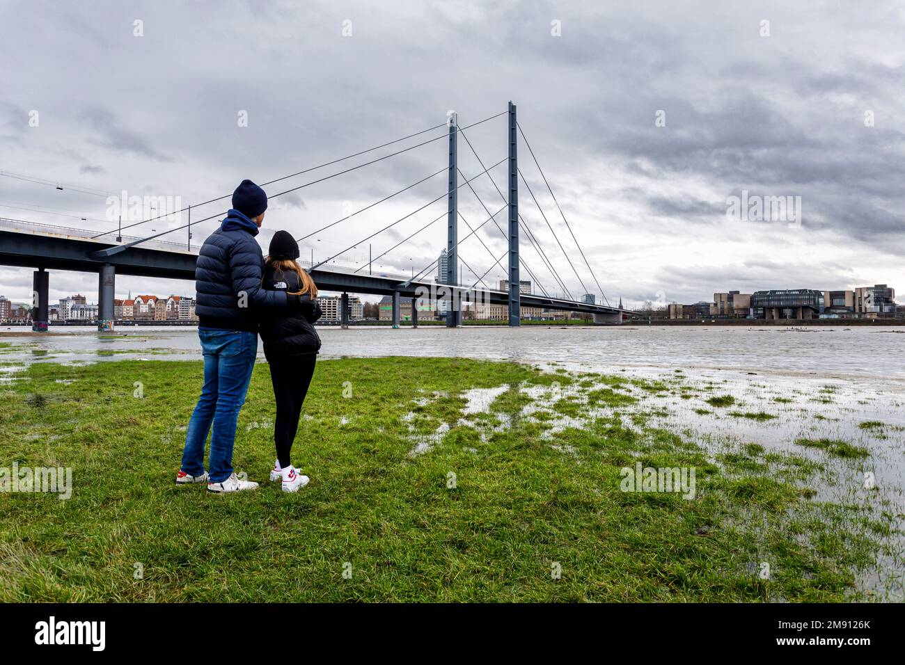 Rising water level on the Rhine in Düsseldorf, plus rain and stormy weather, view of the Rheinkniebrücke, old town, state parliament Stock Photo