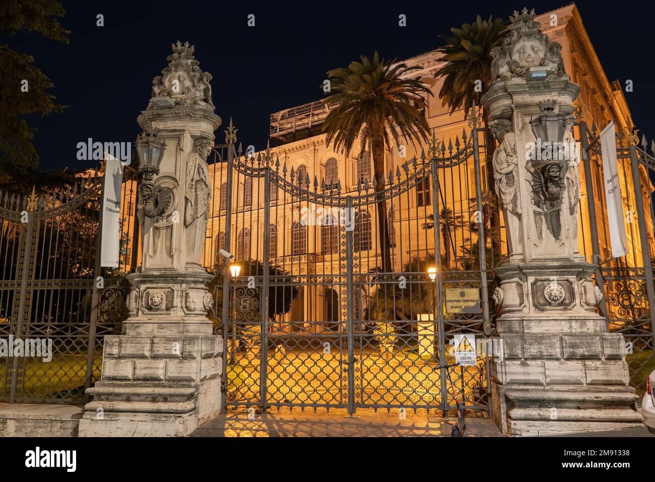 Rome, Italy, gate to the Barberini Palace (Palazzo Barberini) at night, housing National Gallery of Ancient Art (Galleria Nazionale d'Arte Antica). Stock Photo