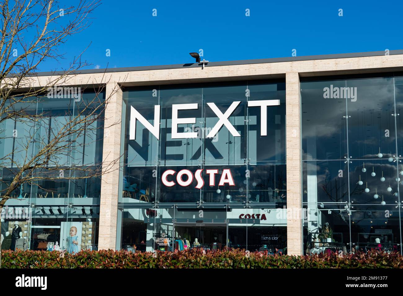 Exterior Signage of the Next clothing and homeware store in the Merry