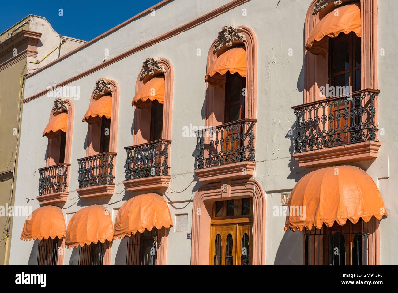 Colorful awnings on an historical building from the Spanish colonial era in the historic center of Oaxaca, Mexico.  UNESCO World Heritage Site of the Stock Photo