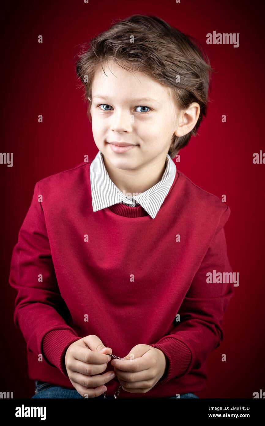 Close up Portrait of Him He Handsome Cute Smiling Smart Caucasian White Boy Dressed in a Red