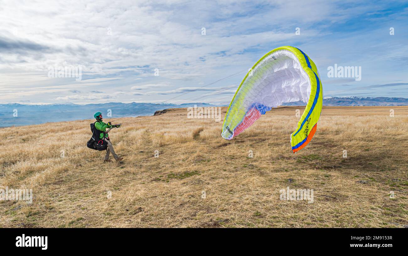 Patrick Mcfarland launches his paraglider near Melba Idaho Stock Photo