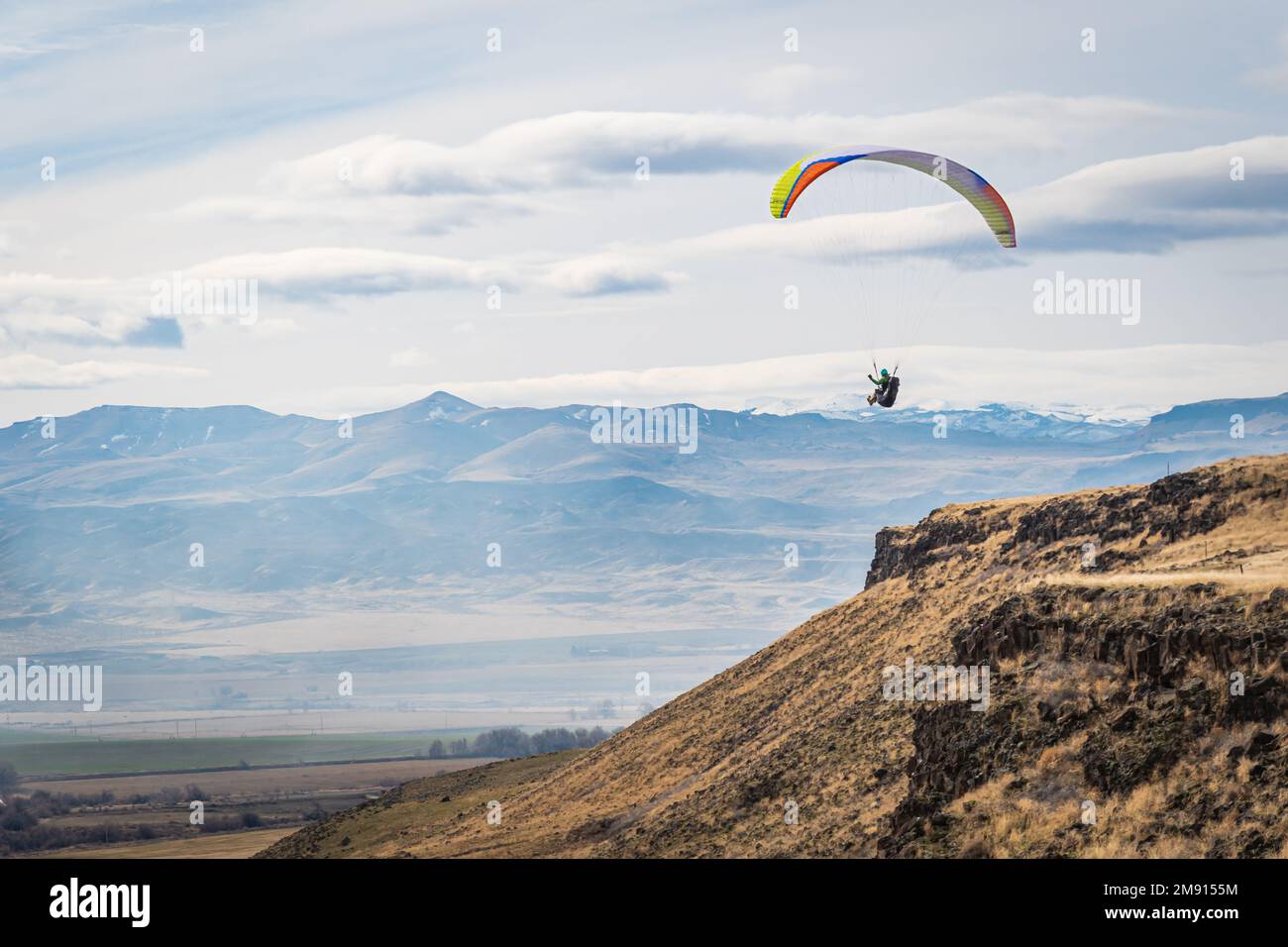Patrick Mcfarland flys his paraglider near Melba Idaho Stock Photo