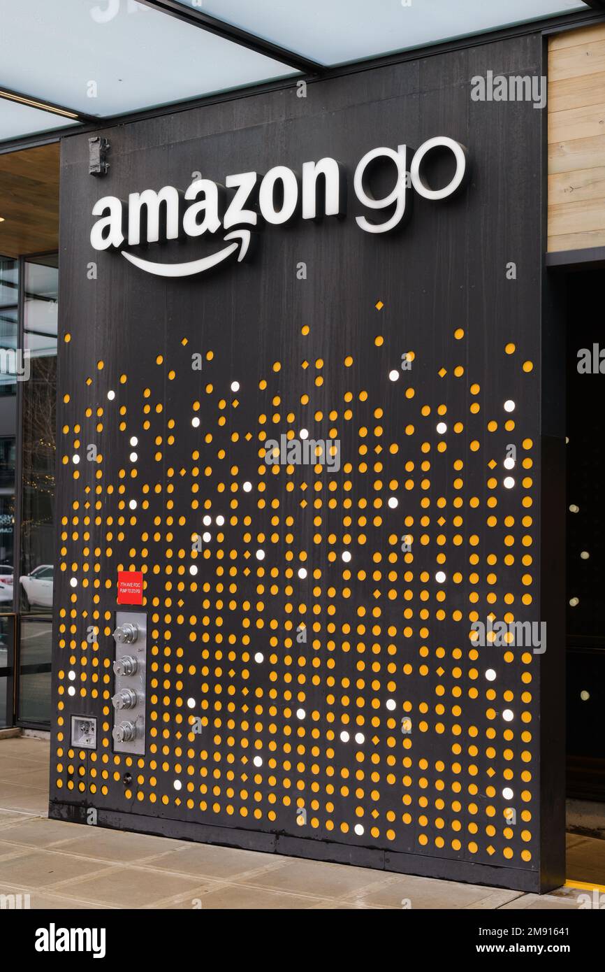 Seattle, WA, USA - January 15, 2023; Downtown Seattle sign for Amazon Go store above wall design Stock Photo