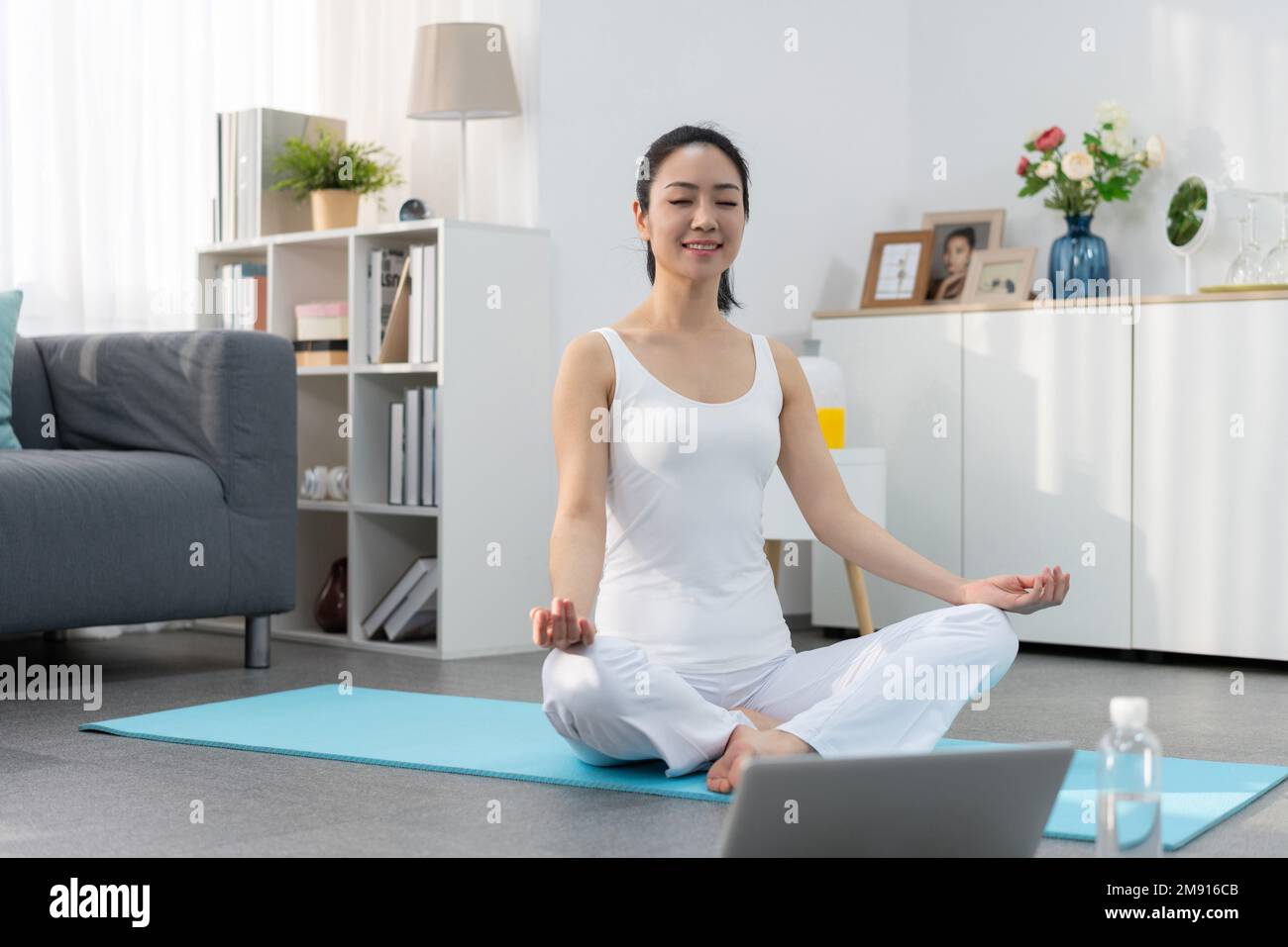 Young woman yoga at home Stock Photo - Alamy