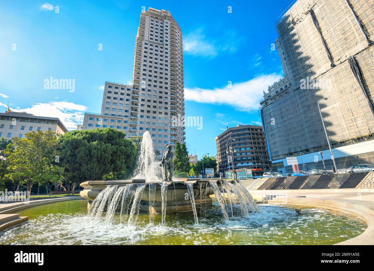 Cityscape with fountain of Water’s Birth on  Plaza de Espana. Madrid, Spain Stock Photo