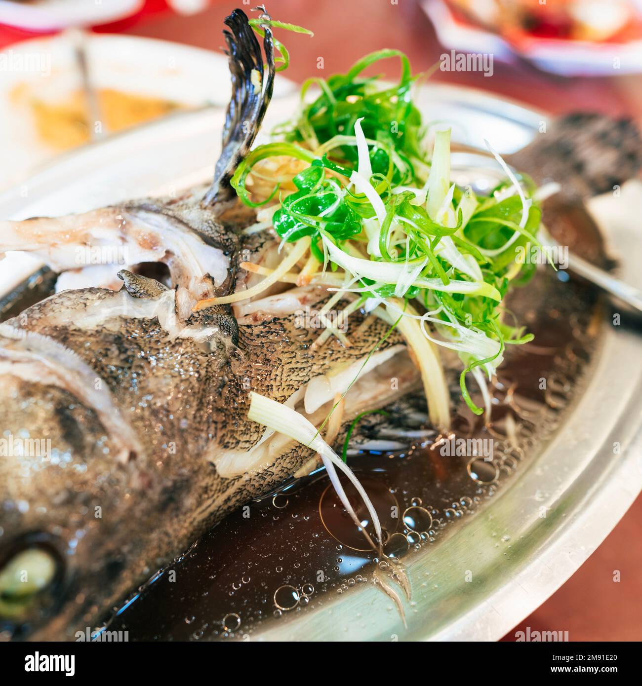 Steamed fish in a plate Stock Photo