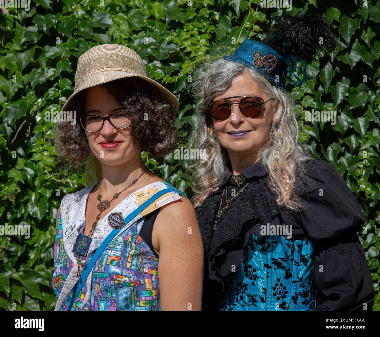 Two female steampunks, wearing explorer, traveller, adventurer themed steampunk costumes. Stock Photo