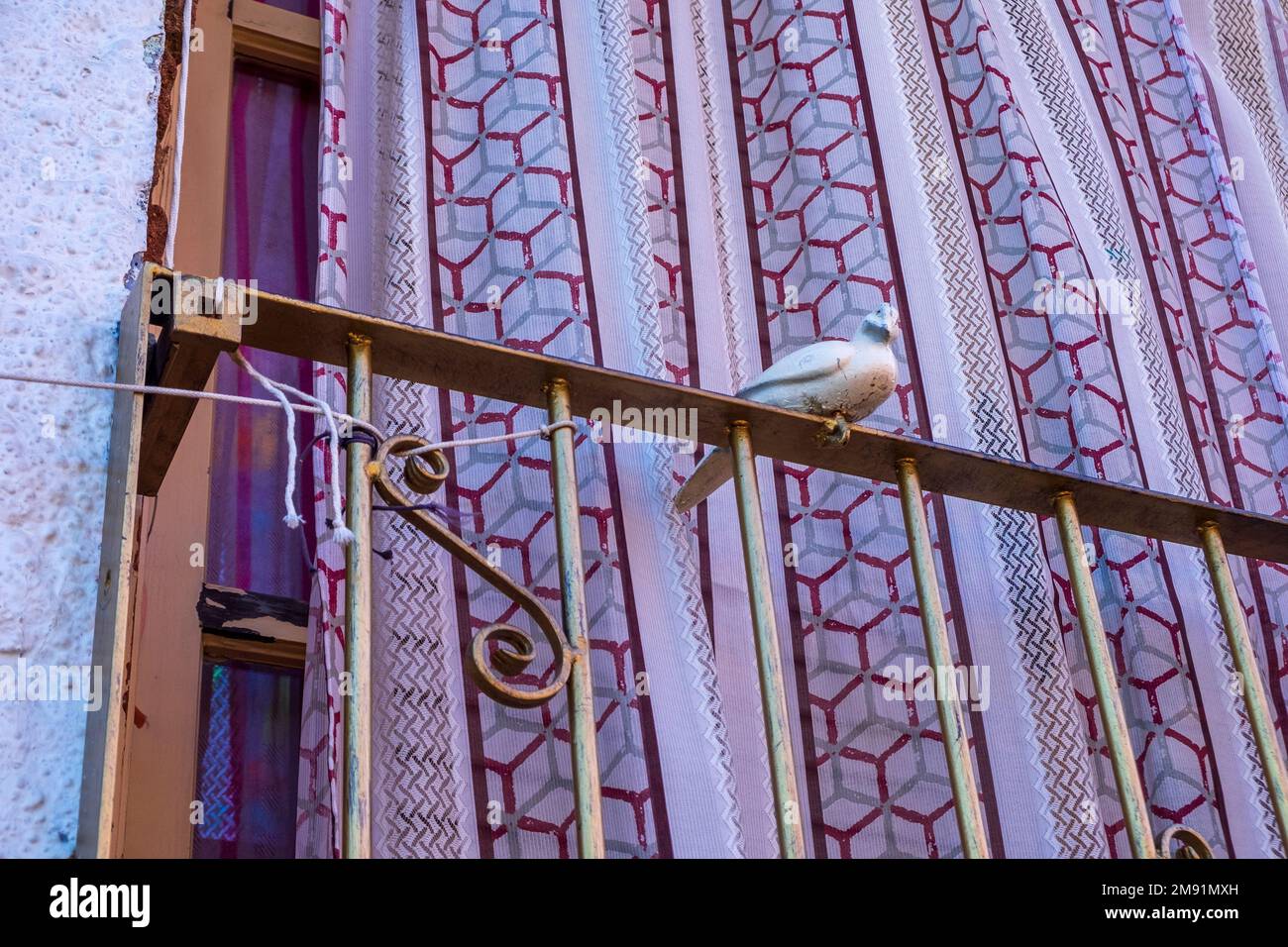 Wooden dove or pigeon, hexagonal design on a window blind, San José del Cao, Baja California, Mexico Stock Photo