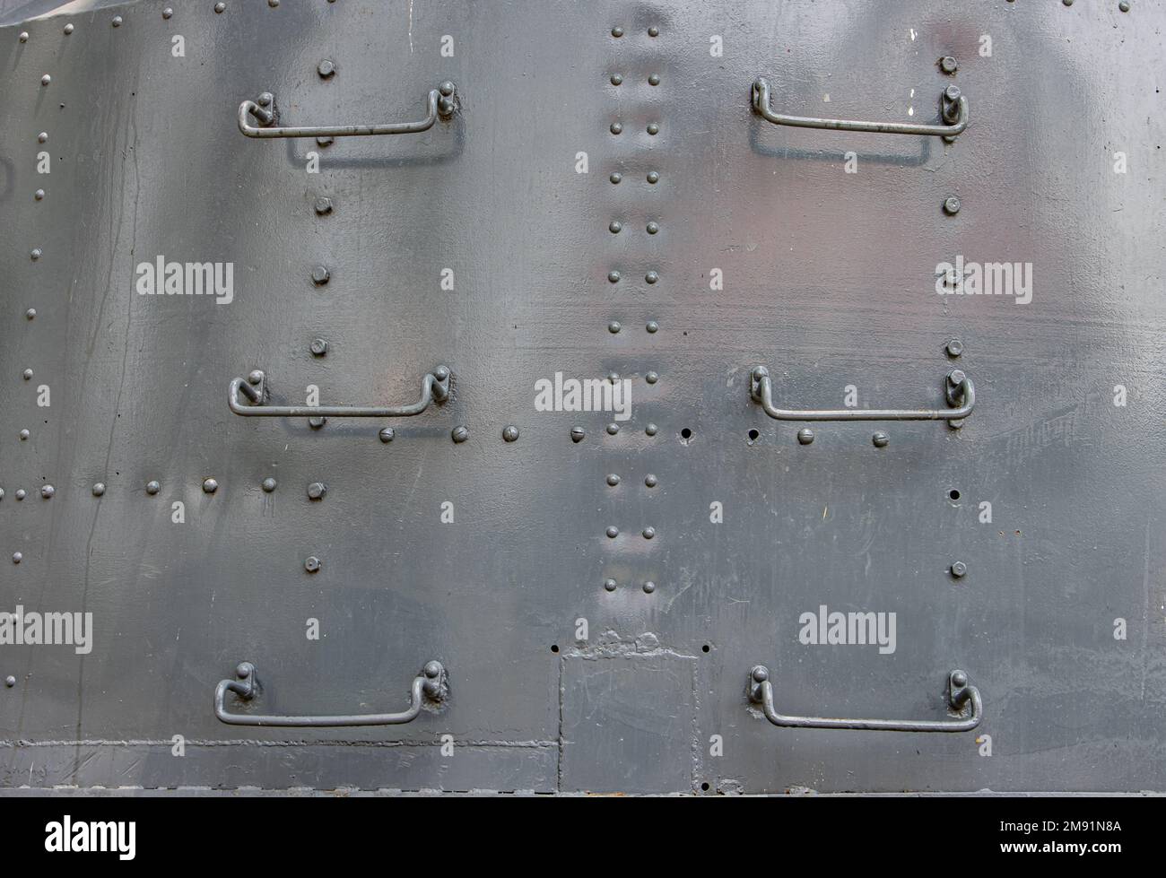 Steps of a ladder on the steel wall of a warship Stock Photo