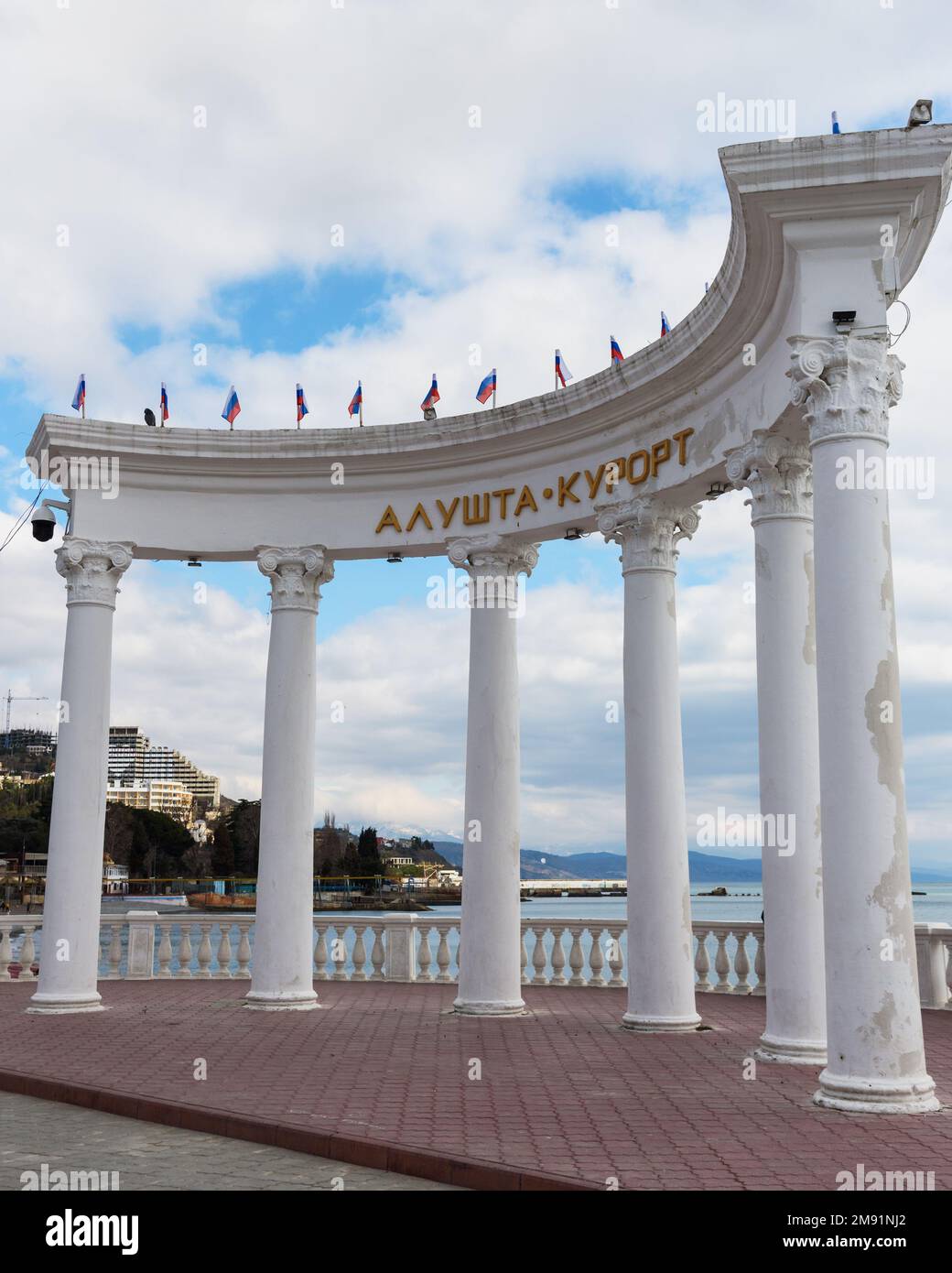Alushta, Crimea - March 25, 2021: White columns on the promenade in spring Stock Photo