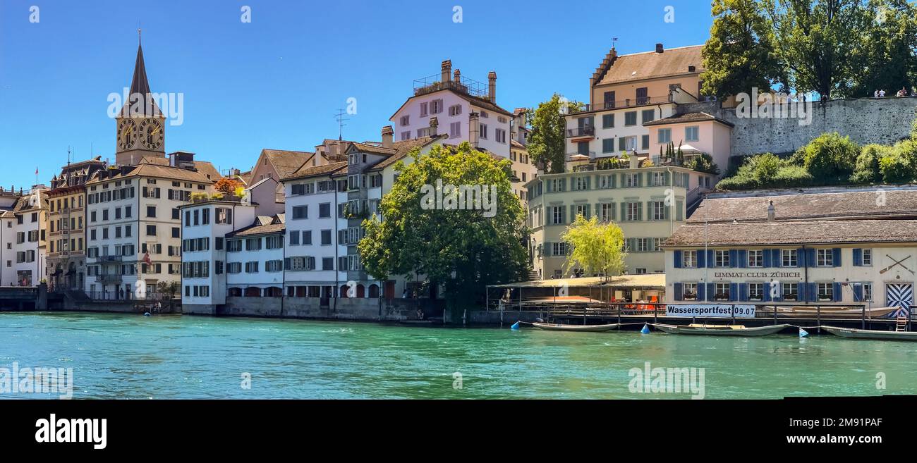 Picturesque view of the houses on the Schipfe and the Church of St. Peter on the banks of the Limmat in Zurich, Switzerland Stock Photo