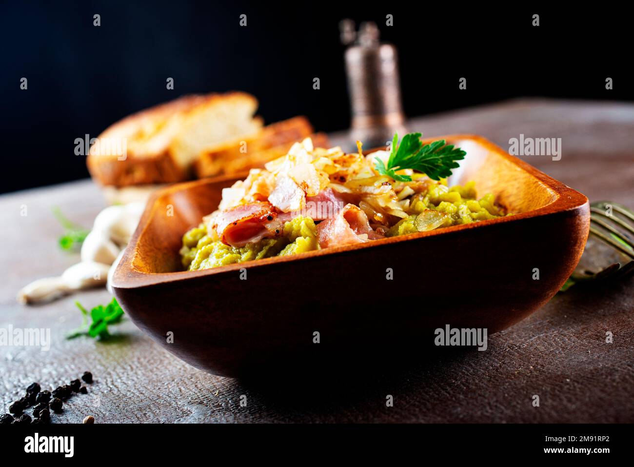 mashed split peas in a bowl on a gray background Stock Photo