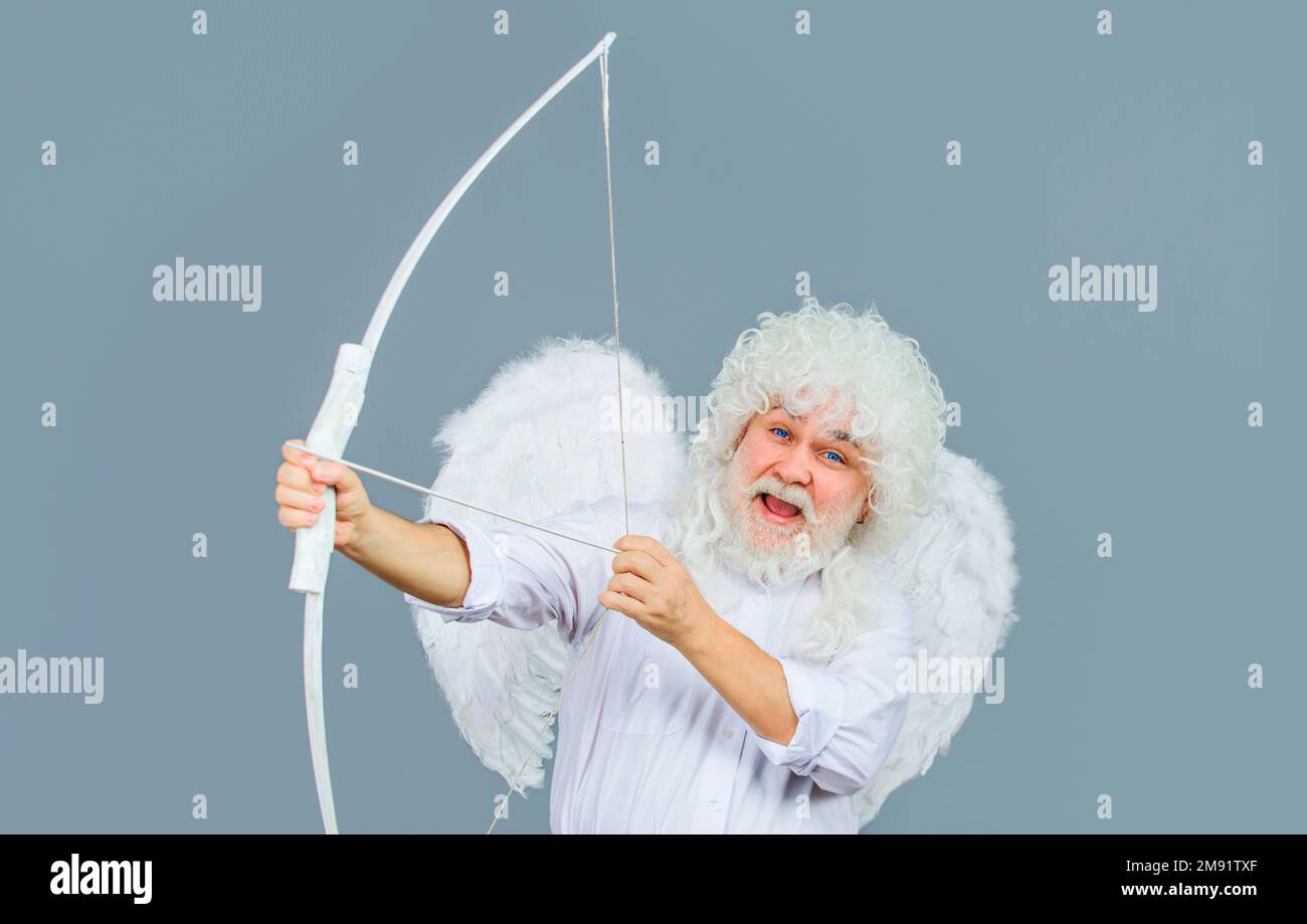 Happy Valentines Day. Cupid angel in white wings with bow and arrows. God of love. February 14. Stock Photo
