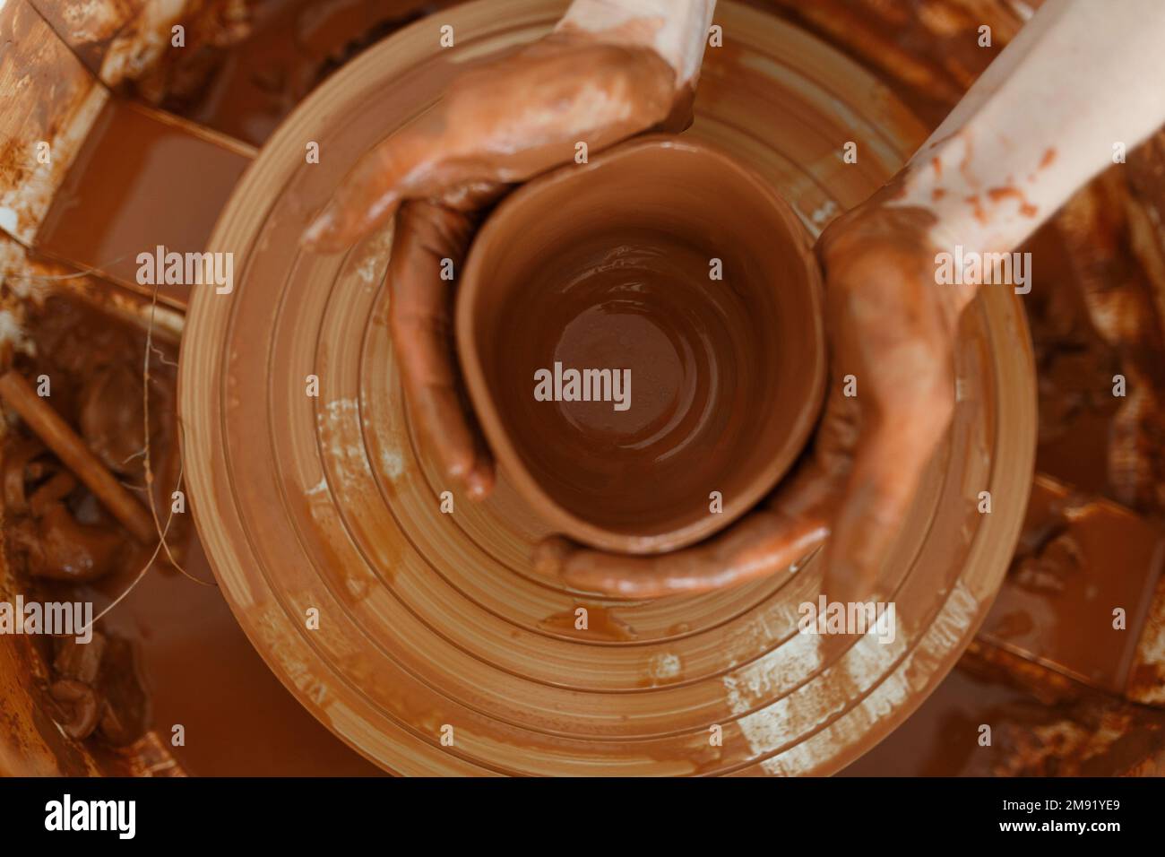 Clay pottery the process of making ceramic crockery. Woman