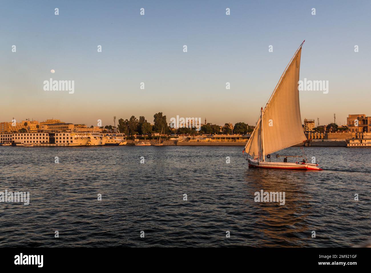 Evening view of felucca sail boat at the river Nile in Luxor, Egypt ...