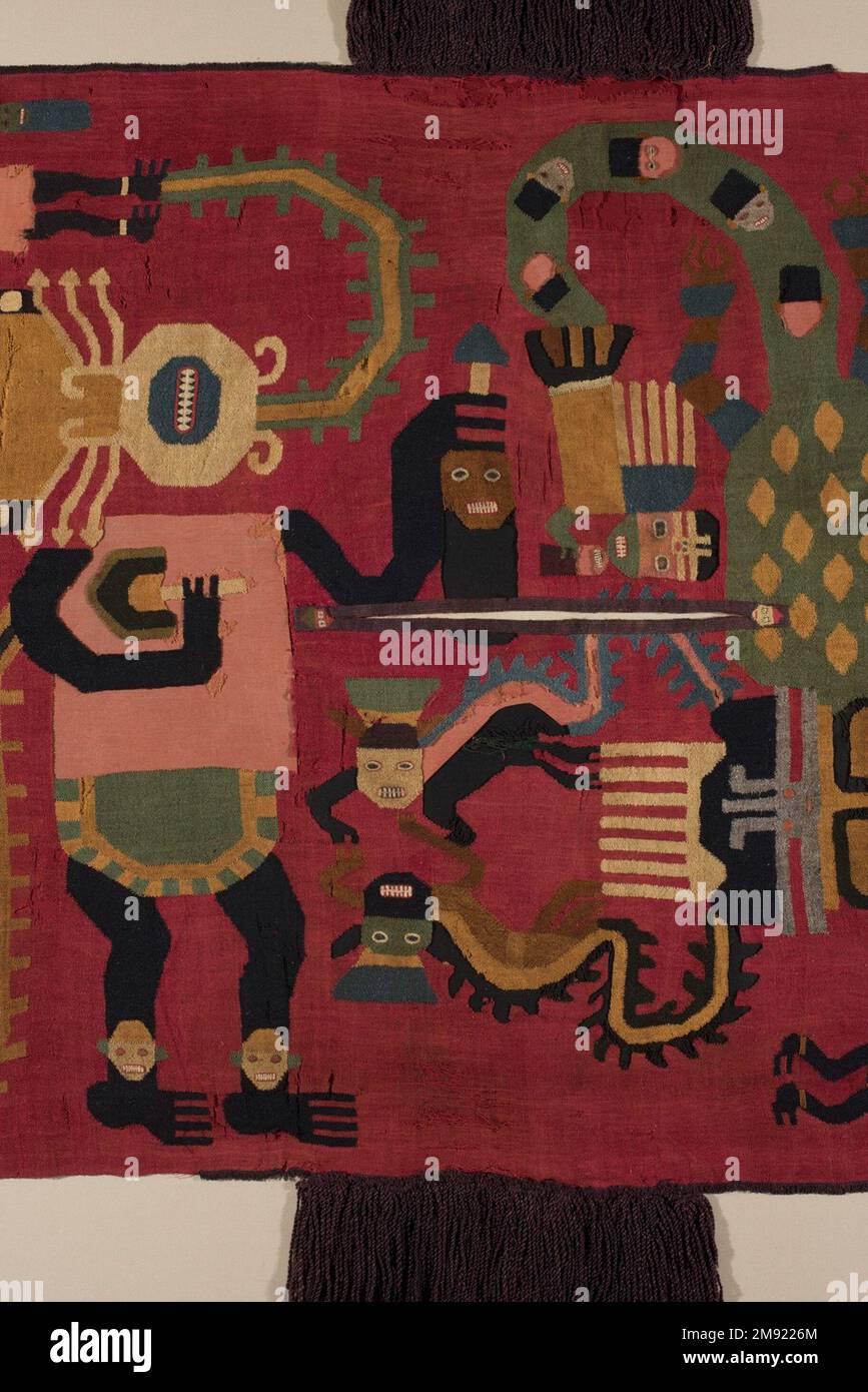 Poncho or Tunic Nasca. Poncho or Tunic, 100-200 C.E. Camelid fiber, 74 7/16 x 27 9/16 in. (189.1 x 70 cm).  This large panel is the most elaborate example of the discontinuous warp and weft technique in the Museum’s collection. With this technique, the warps and wefts on the textile change with every color and weaving session, rather than being continuous along the length and width of the fabric (see diagram). The bold designs on the red background include three large, colorful supernatural beings connected to several smaller figures. The largest figure wears a green and yellow feline pelt and Stock Photo